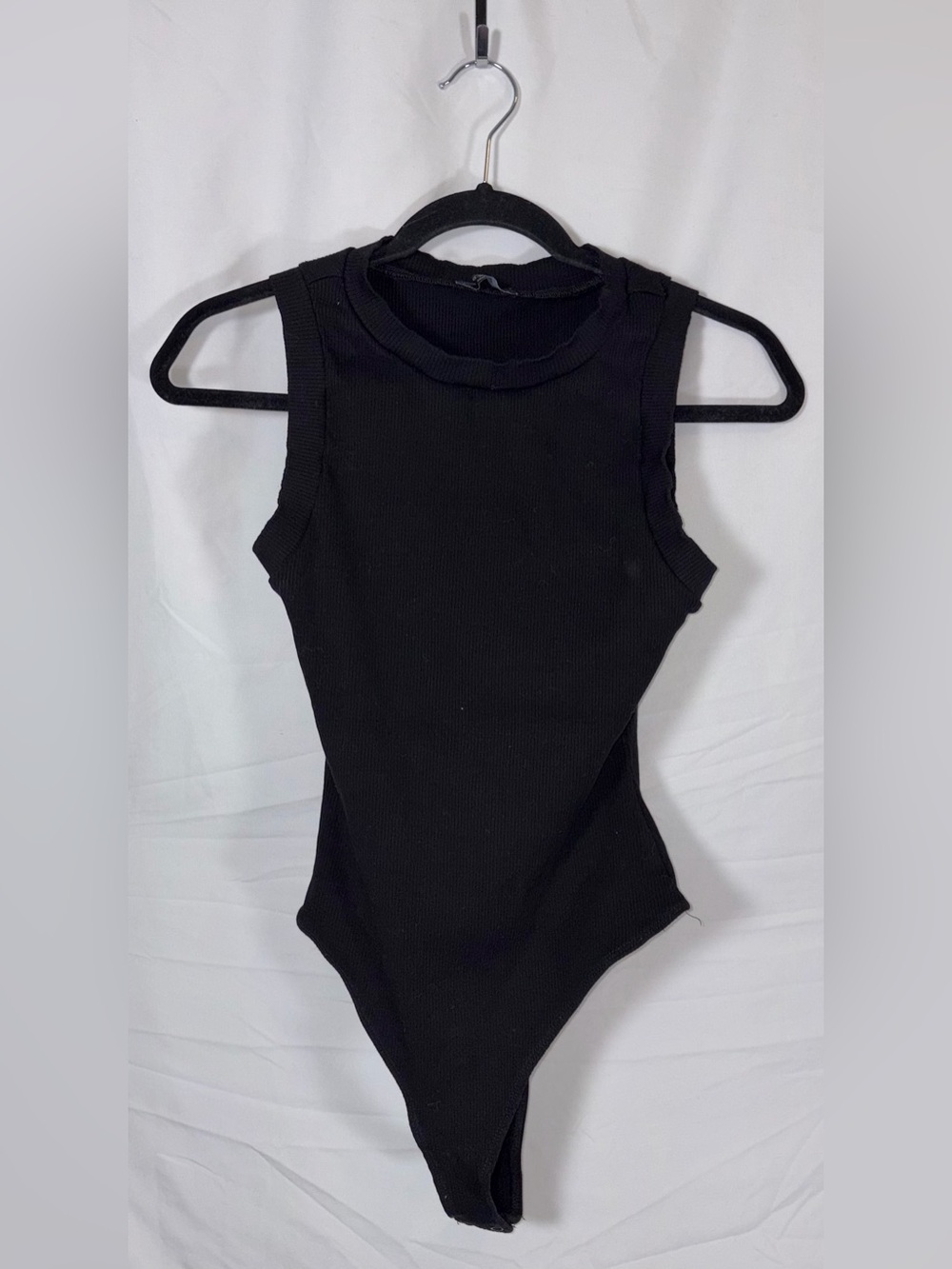 naked wardrobe Black Ribbed Sleeveless One-Piece Bodysuit - Picture 1 of 7
